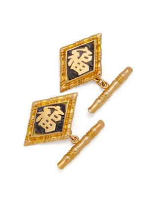 two pairs of gold and black enamel cufflinks with chinese characters