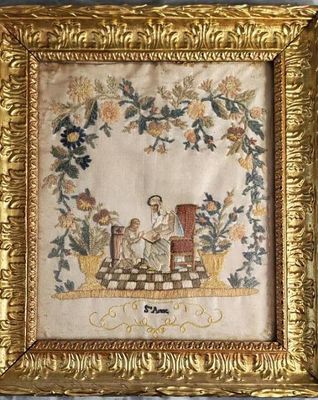 une broderie ancienne représentant un homme et une femme assis sur un banc