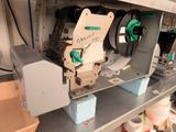 a machine that is sitting on a shelf in a room