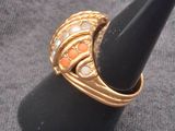 a black cone with a gold ring on top of it