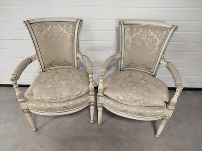 pair of antique french style chairs with upholstered cushions