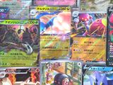 a lot of pokemon cards that are on the table