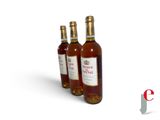 three bottles of wine sitting next to each other on a white surface