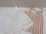 two pieces of clothing that are on a table