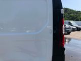 a white van that is parked in a parking lot
