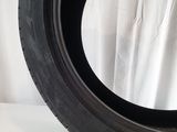 a close up of a tire on a white surface