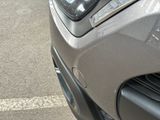a close up of a car ' s headlight and front bumper