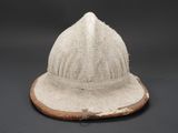 a close up of a hat on a black surface