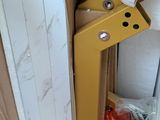 a cardboard box with a piece of construction equipment inside of it