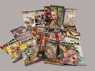 a lot of comic books that are on the table