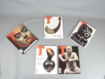 four books of art and sculpture on a white surface