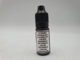 a bottle of liquid sitting on top of a white surface