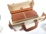 a suitcase with two compartments open on a table