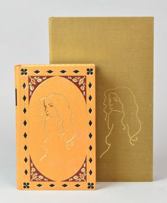 a book with a picture of a woman on it next to a box