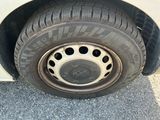 a close up of a tire on the side of a car