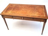 a small wooden table with two drawers on it