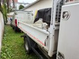 a white truck that is parked in the grass
