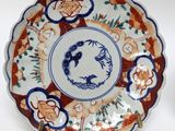 a blue and white plate with a picture of a cat on it