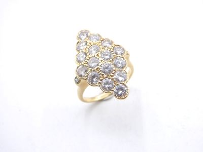 a close up of a diamond ring on a white surface