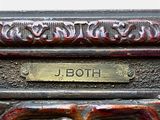 a close up of a metal box with a nameplate on it