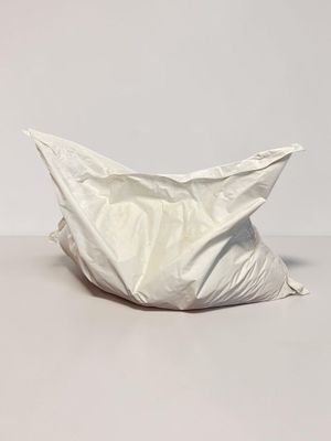 a white bag sitting on top of a table