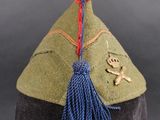 an image of a military hat with a tassel on it