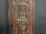 an old wooden door with carvings on it in a museum