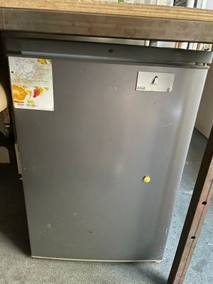 an image of a small refrigerator in a kitchen