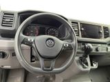 a steering wheel and dashboard of a car with a clock