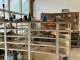 many shelves that are in the middle of a room