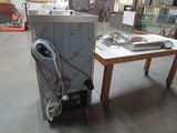 a machine that is sitting on a table in a room