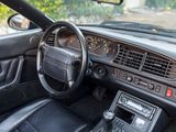 a car dashboard with a steering wheel and a dash board