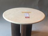 the table is made of wood and has a white marble top