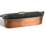 an old copper pan with a handle on a white background