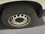 a close up of a tire on a white car