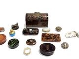 many different types of jewelry sitting on a white surface