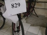 a bicycle with a sign on the front of it