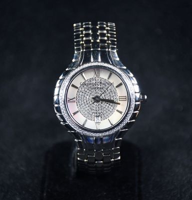 a close up of a watch on a black surface
