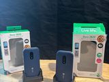 two boxes of wii remotes sitting on a table next to a box of wii remotes