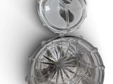 an image of a close up of a glass object on a white surface