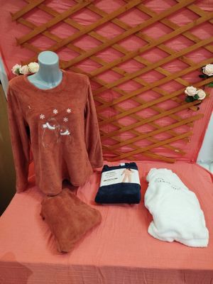 a pink bed with a pink blanket and a pink blanket