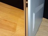 a close up of a laptop on a wooden table