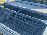 a truck with a basket in the back of it