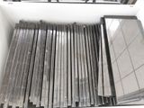 a lot of different types of metal bars in a box