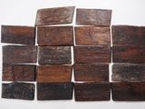 several pieces of wood are arranged on a white surface