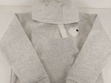 a close up of a grey hoodie with a white tag on it