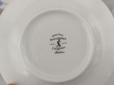a white plate with a picture of a cat on it