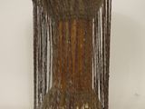 a small wooden drum with a chain around it