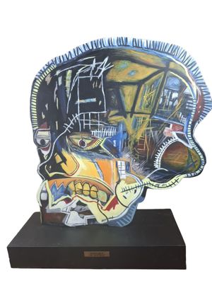 a sculpture of a fish that is on a black stand