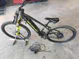 a bicycle that is sitting on the floor in the garage